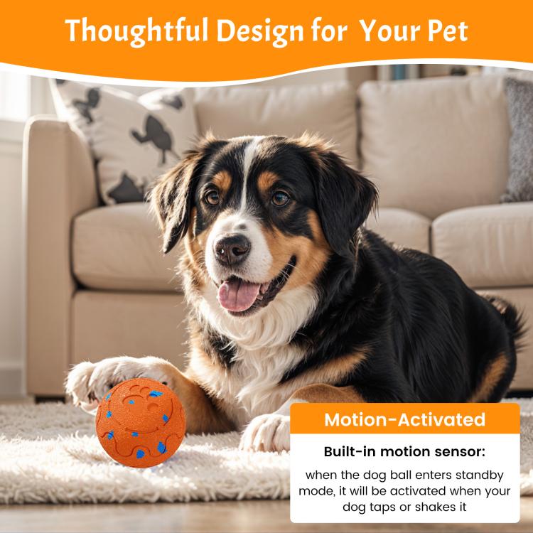 Orange dog toy ball with blue motion sensor styling, beside a Bernese puppy
