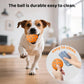 Orange smart pet toy ball with blue paw pattern in front of a dog