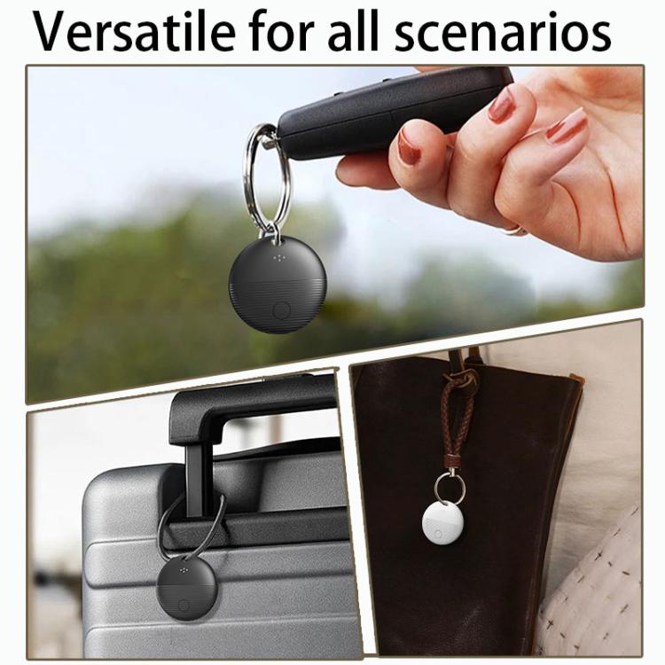 Black round mini GPS Bluetooth location tracker with key ring, held in hand