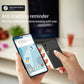 Hands hold smartphone and point near a black thin smart card GPS Bluetooth tracker.
