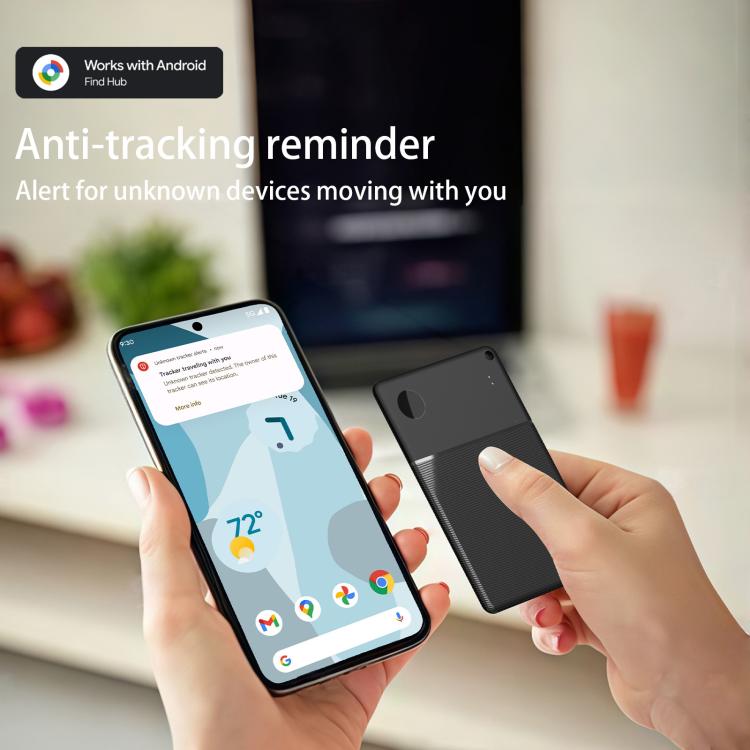 Hands hold smartphone and point near a black thin smart card GPS Bluetooth tracker.