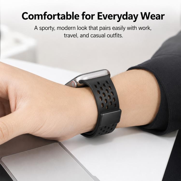 Black perforated silicone watch band with magnetic clasp worn on a wrist