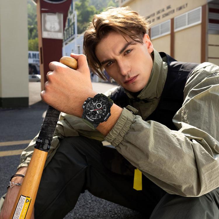 Black rugged sports watch on a wrist with textured band and round face