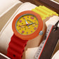 Yellow silicone student watch with orange bezel and green dial with star pattern