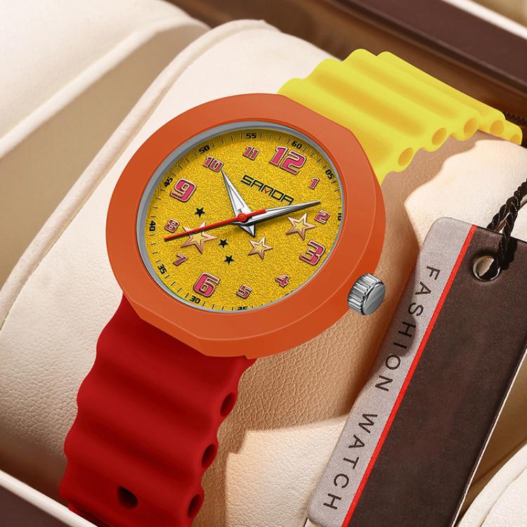 Yellow silicone student watch with orange bezel and green dial with star pattern