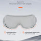 Gray ergonomically contoured eye massager with curved padded underside