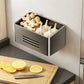 Grey magnetic refrigerator storage rack with large open bin holding garlic