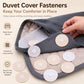 Round duvet cover fastener discs with snap centers, attached to bedding