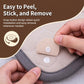 Peel-and-stick snap fasteners on quilt seams, round beige discs with white centers