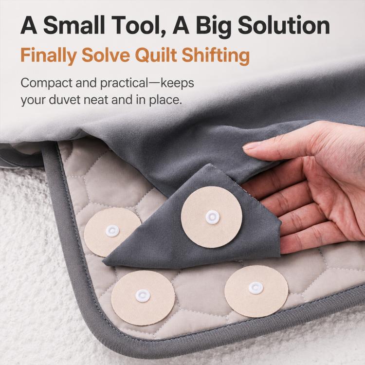Round duvet fastener discs with snap centers, attached along quilt edge