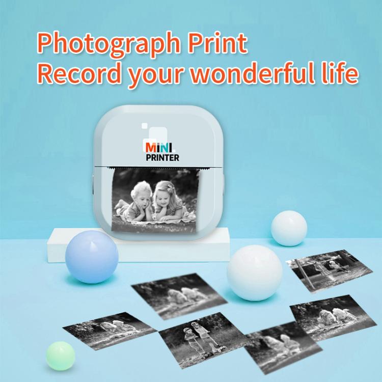 Light blue mini inkless thermal printer printing a photo image