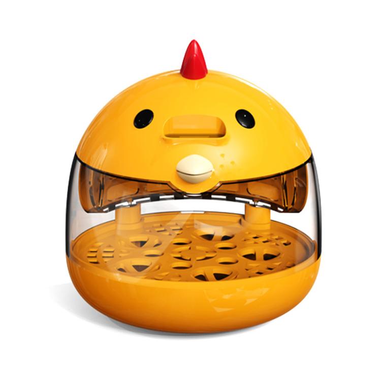 Yellow mini incubator with clear dome lid and empty perforated egg tray