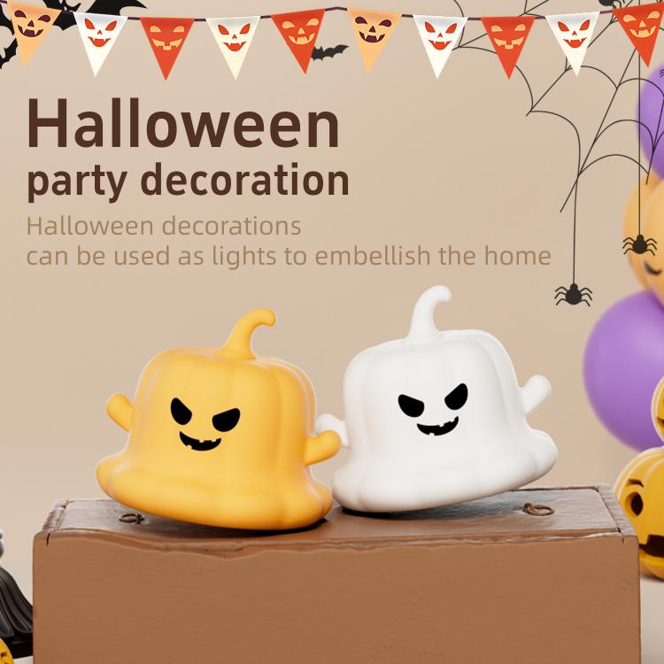 Yellow and white silicone pumpkin ghost night lights on a cardboard box