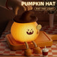 Pumpkin hat silicone night light on a tray, jack-o’-lantern face, lollipop detail, orange glow