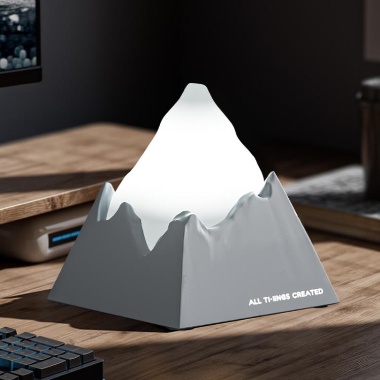Light grey mini volcano aroma diffuser night light with bright white glow peak