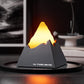 Dark grey mini volcano aroma diffuser night light with amber glowing peak