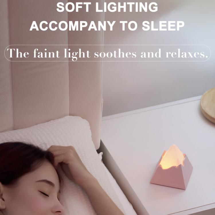 Mini volcano aroma diffuser night light with warm flame glow on pink base