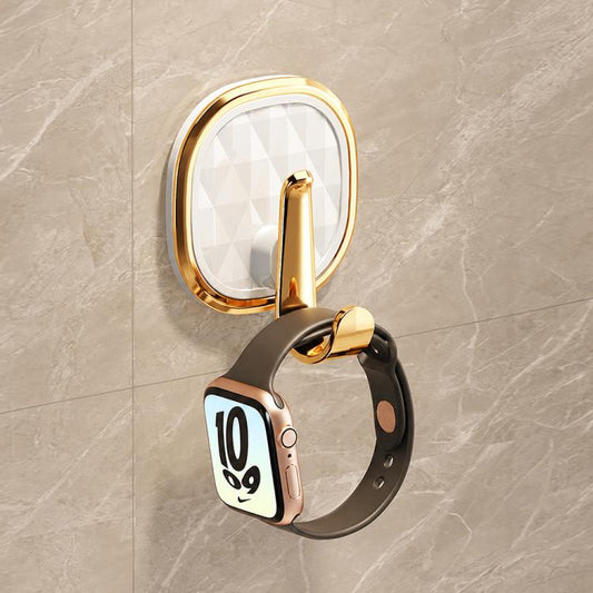 No-drill adhesive wall hook with clear faceted oval backing and gold hook