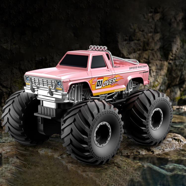 Pink amphibious 4WD RC monster truck with oversized tread tires and front grille.