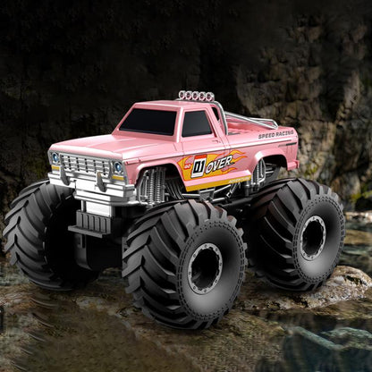 Pink amphibious 4WD RC monster truck with oversized tread tires and front grille.