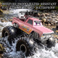 Pink amphibious 4WD RC monster truck climbing rocky water with big tread tires.