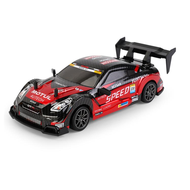 Red remote control drift car with rear spoiler and racing decals