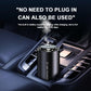 Black car aroma diffuser in a dashboard vent area, releasing a mist plume
