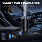 Car aroma diffuser on console area with mist output in the vehicle