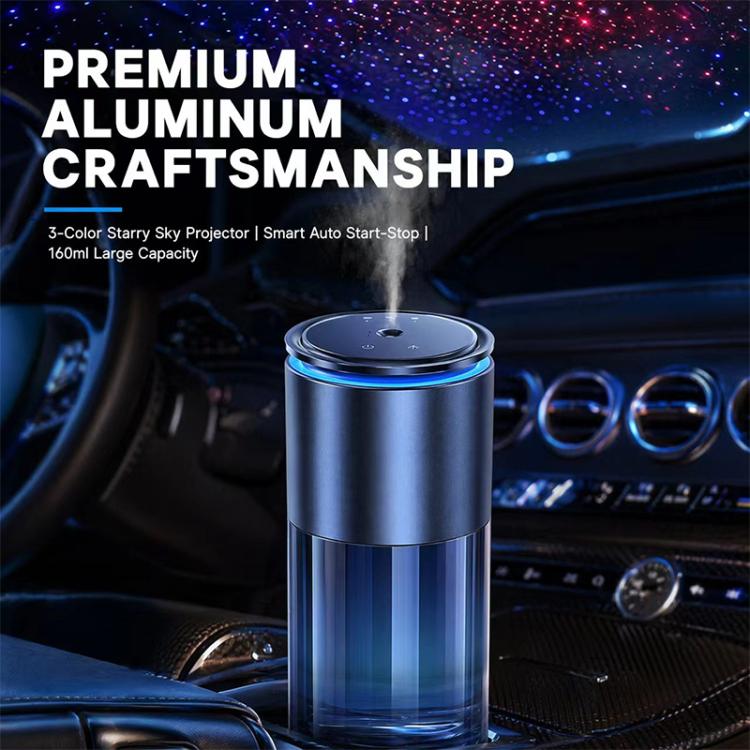 Car aroma diffuser with blue-lit top, brushed silver cylinder on the dashboard