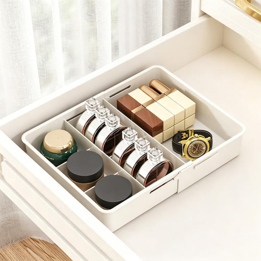 White divided drawer storage box with multiple compartments for small items and bottles