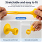 Stretchy yellow silicone suction pad accessory holding a handle