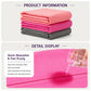 Stack of pink and grey yoga towels, showing textured microfiber surface.