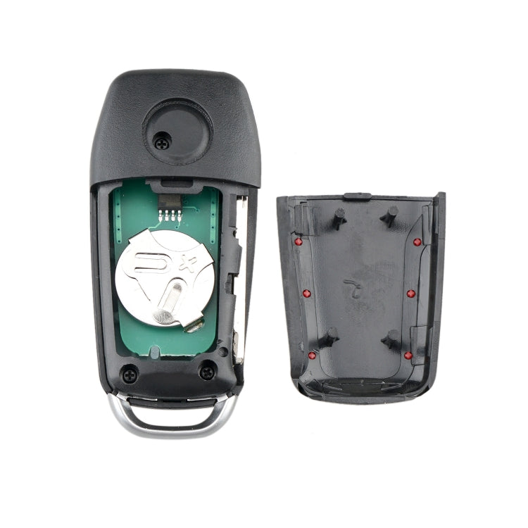 Car key fob opened to show internal battery and circuit board