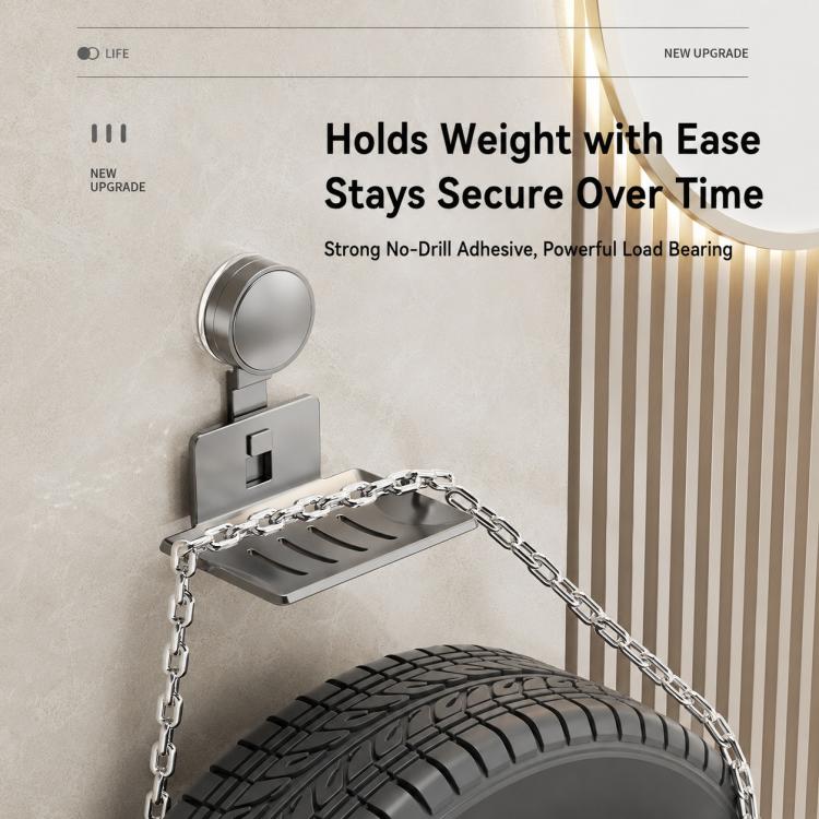 Wall-mounted suction cup soap holder with silver-gray metal drain tray and loop base