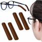Soft silicone eyeglass ear pads, brown pair shown with eyeglass temple and wearer.