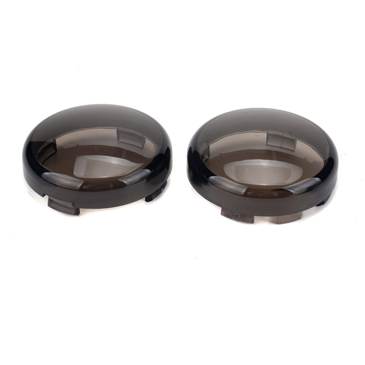 Two black smoked motorcycle turn signal covers with molded mounting tabs