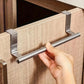 Hand adjusting stainless steel towel rack on cabinet door with end holders