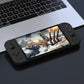 Black handheld game console with front controls and battle-game display