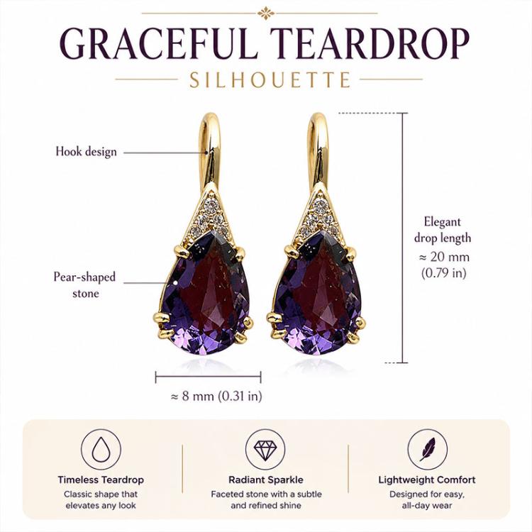 Graceful teardrop earrings with purple pear-shaped stones, gold-tone hooks, and clear accents.