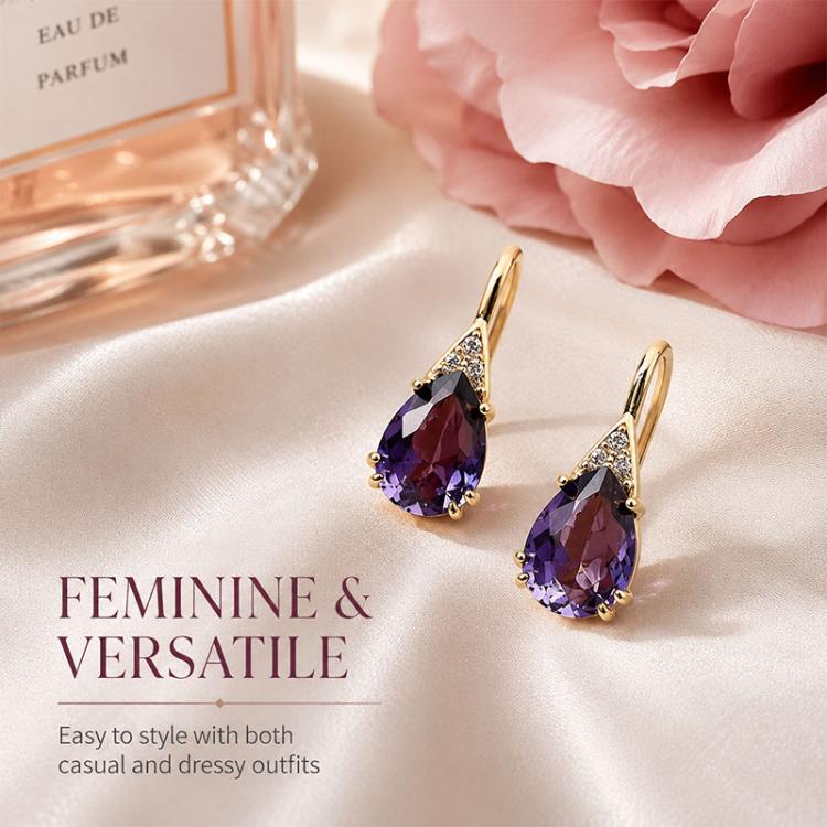 Purple crystal teardrop earrings with gold-tone hooks and small clear stones for shine.