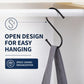 Black iron S hooks on a rail, holding a gray towel with open hook design