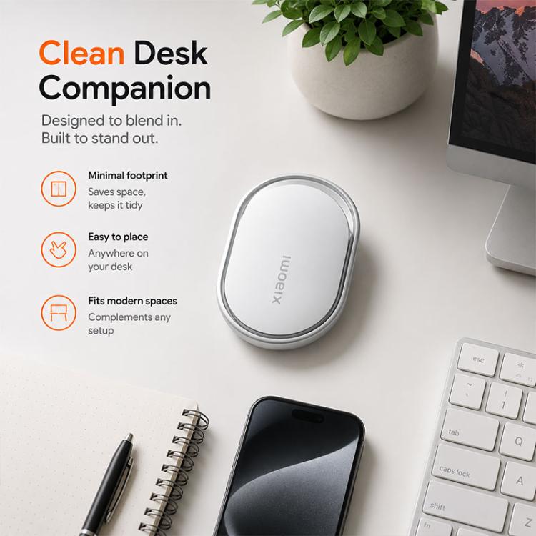 Xiaomi wireless smart tracker tag on desk, white oval with silver border