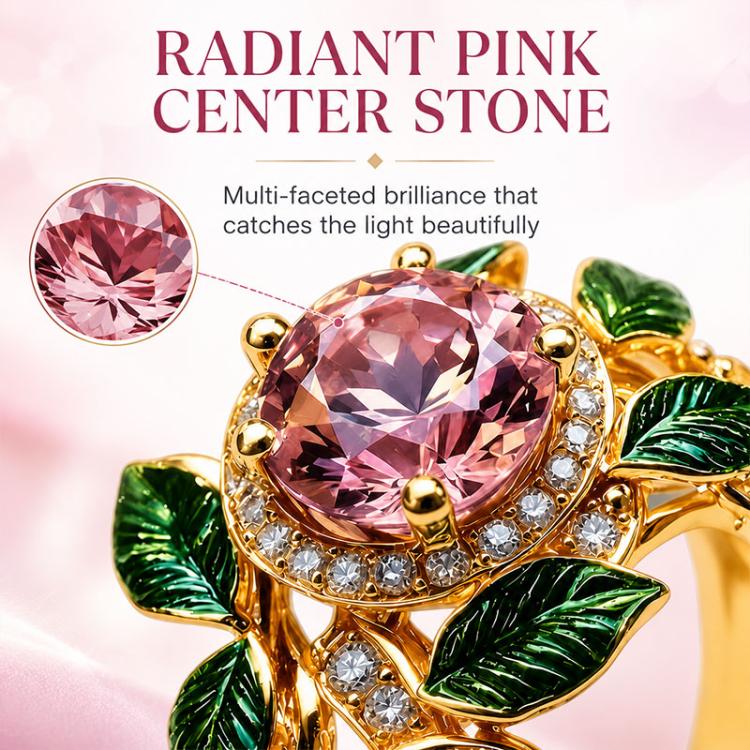Close-up pink faceted center gemstone ring with gold prongs, crystals, green enamel leaves