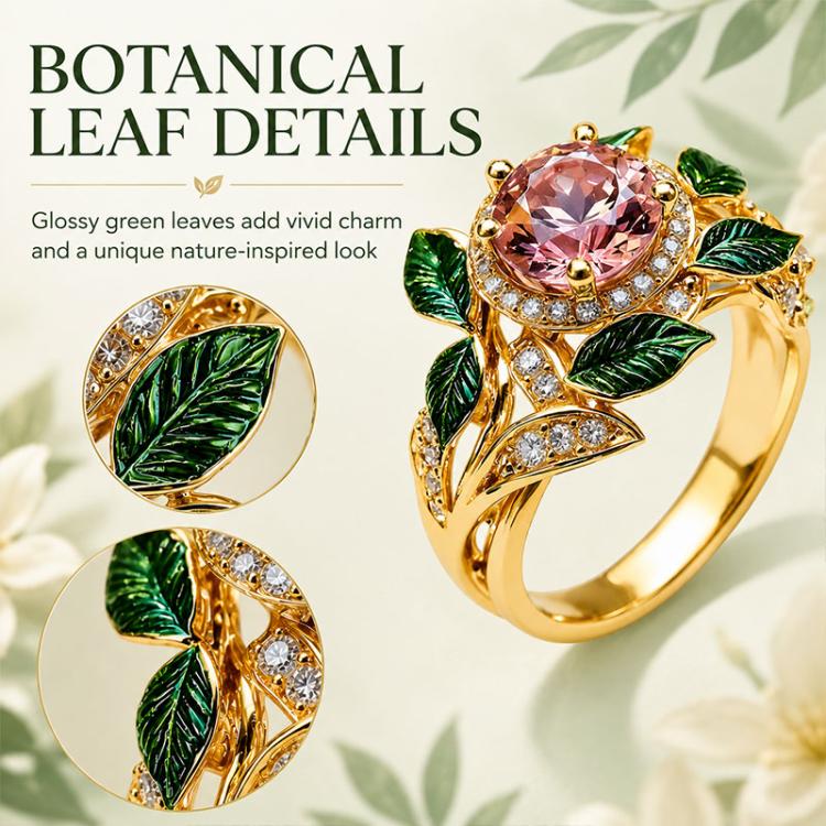 Gold-tone pink gemstone ring with green enamel leaf details and crystal band accents