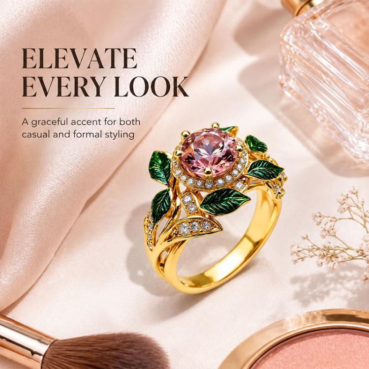 Gold-tone pink center gemstone ring with green enamel leaf motif and crystal details