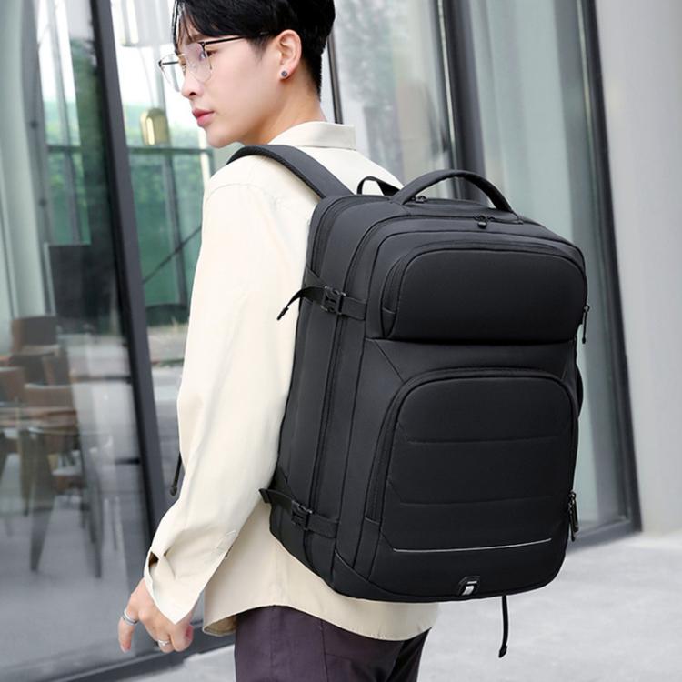 Black large-capacity business backpack with front zip pockets and adjustable shoulder straps