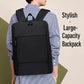 Black large-capacity laptop backpack with top handle and front zip pocket