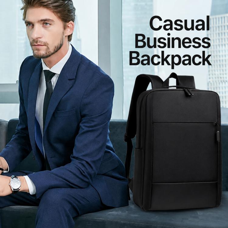 Black business laptop backpack with zip front and padded shoulder straps on a model