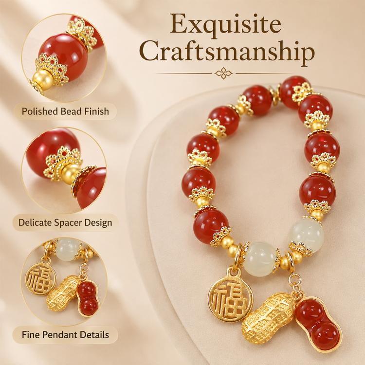 Red bead bracelet with gold-tone coin charm, peanut charm, and white beads
