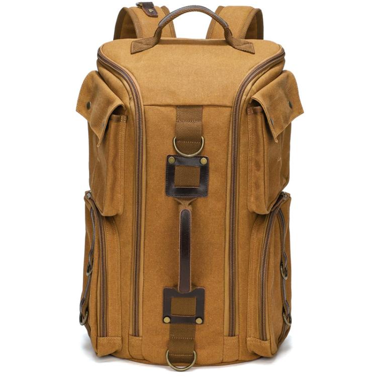 Earthy yellow canvas travel backpack with top handle, side zippers, and front utility pockets